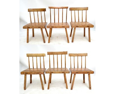 A harlequin set of six late 18th century Welsh rustic ash and elm comb-back chairs with simple shaped top rails, five turned 