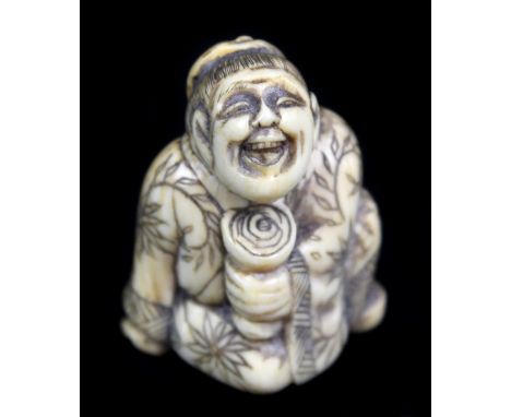 A late 18th century Japanese carved ivory netsuke of a seated foreigner holding a stem cup, height 3.6cm.Additional Informati