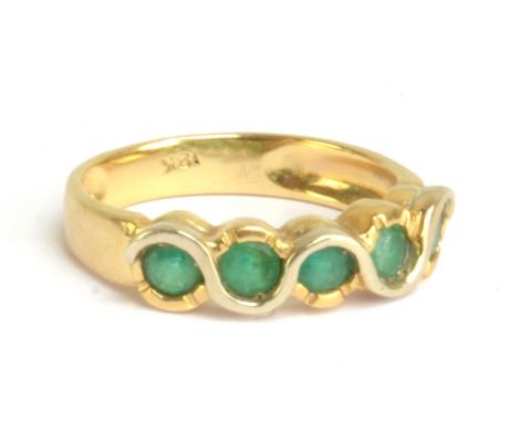 An 18ct yellow gold five stone emerald ring, size O, approx 3.9g.