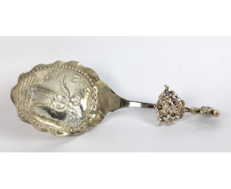 A Dutch silver caddy spoon with embossed scallop moulded bowl, length 12.5cm.