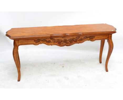 A reproduction walnut console table, length 151cm.