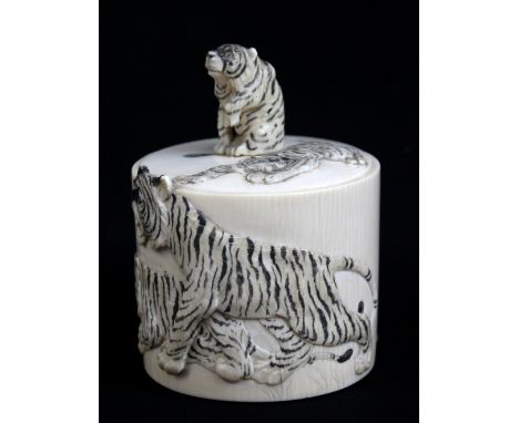 A Japanese Meiji period ivory tea caddy of cylindrical form with tiger cub mount to the lid and detailed stained and carved l