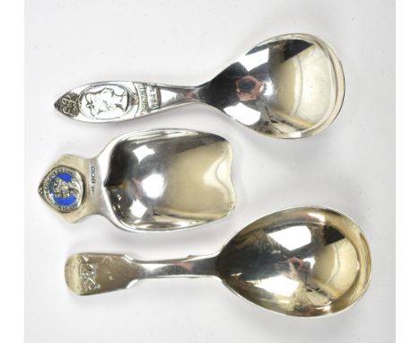 A Victorian hallmarked silver caddy spoon with engraved initials to the terminal, London 1856, length 10cm, and a small silve