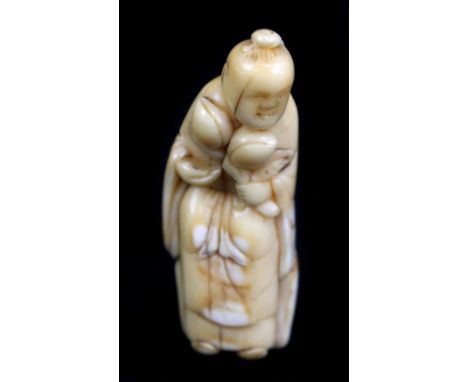 A early 19th century Japanese carved sperm whale tooth netsuke of Seiobo, height 5cm.Additional InformationDiscolouration and