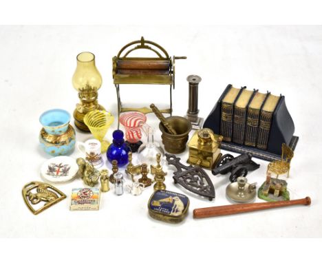 A collection of various miniatures to include a brass mangle, a coffee grinder, an iron stand, a chair made of a pocket watch