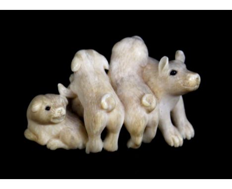 A Japanese Meiji period carved ivory netsuke modelled as a group of five puppies, signed to base, length 4cm.Additional Infor