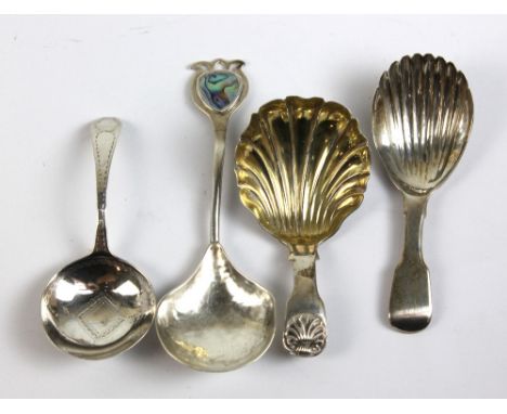 A George IV hallmarked silver scallop moulded caddy spoon, London 1827, two further hallmarked silver caddy spoons and an Art