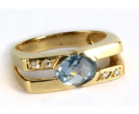 An 18ct yellow gold blue topaz and diamond ring, size Q, approx 4.9g.