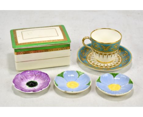 MINTON; a porcelain cabinet cup (af) and saucer with turquoise enamel and gilt decoration, purple printed marks and no. G4679