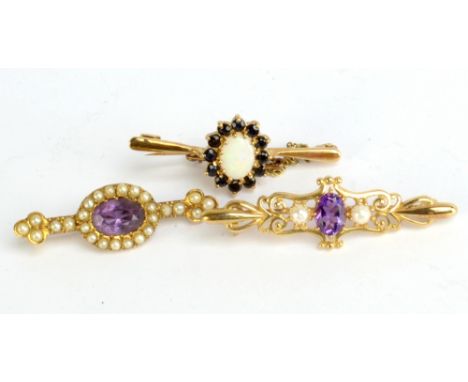 A 9ct yellow gold opal bar brooch and two yellow metal seed pearl set brooches (3).