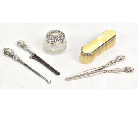 A pair of silver-handled glove stretchers, silver-handled glove hook, silver-handled curling tongs, silver enamel-backed brus