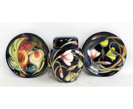 MOORCROFT; a navy ground tubeline decorated 'Queen's Choice' pattern dish with impressed marks and year cipher for 2001 to ba