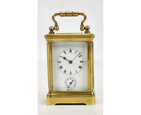 A French brass-cased miniature carriage clock, the circular dial set with Roman numerals and subsidiary dial (af), with singl