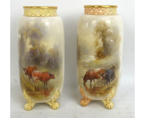 ROYAL WORCESTER; a pair of spill vases with pierced tops and bodies decorated with cattle by John Stinton, both signed, blue 