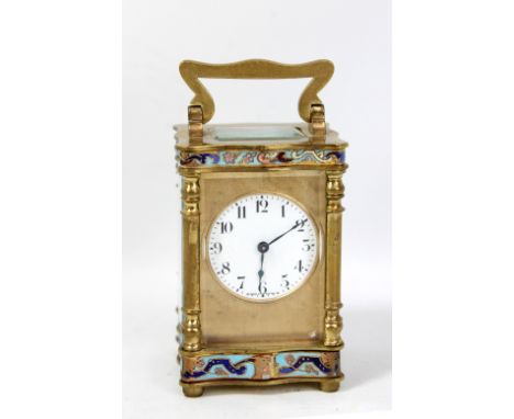 A small French brass cased carriage clock with enamelled detail, the circular dial set with Arabic numerals, single train mov