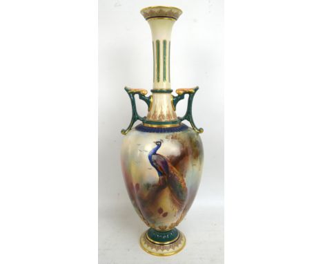 ROYAL WORCESTER; a twin handled vase painted with a peacock in continuous landscape signed A. Chidley, green printed marks to