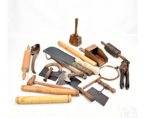 A quantity of predominantly 19th century treen including kitchen tools, chopper, press etc.