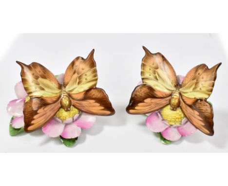 HEREND; a pair of hand painted figures of butterflies perched on flowers, both marked to base, height 7.1cm (2).Additional In