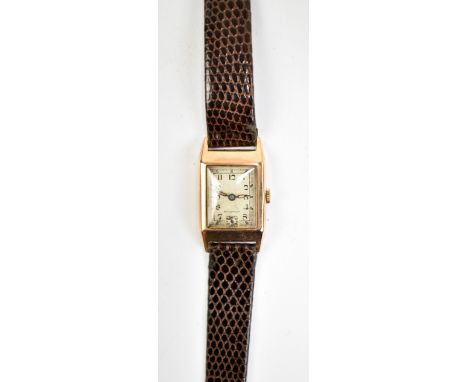 An Art Deco 9ct yellow gold gentleman's vintage tank wristwatch with rectangular dial set with Arabic numerals, width excludi