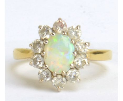 An 18ct yellow gold diamond and opal floral cluster ring, size P, approx 4.3g.