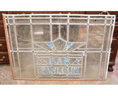 A vintage leaded stained glass panel 'Bar, Parlour' (af), width 100cm.