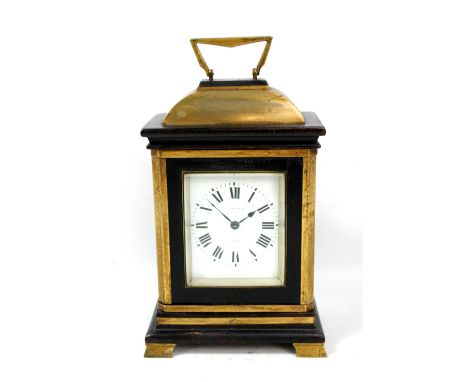 A late 19th/early 20th century French gilt and ebonised wood mantel clock, the enamelled circular dial set with Roman numeral