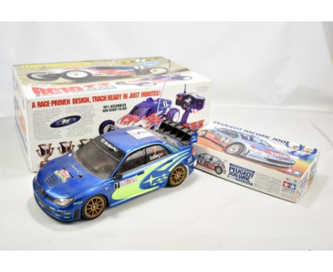 TEAM ASSOCIATED; a boxed 7010 RC10 T3 RTR 1:10 scale electric off-road racing truck, assembled, with two channel stick radio 