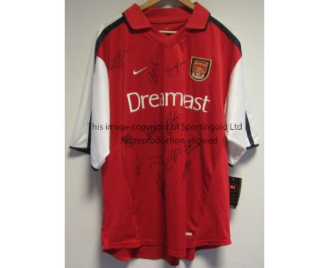 ARSENAL AUTOGRAPHS     A 2001/2 red shirt which is multi-signed by 15 players including Bergkamp, Adams, Pires, Vieira, Ljung