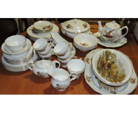 A part dinner and tea service by the Fenton china company to include a tureen and cover, teapot, dinner plates and a teapot