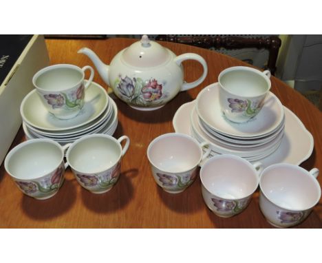 A Susie Cooper Parrot Tulip part tea set in green, together with another similar in pink