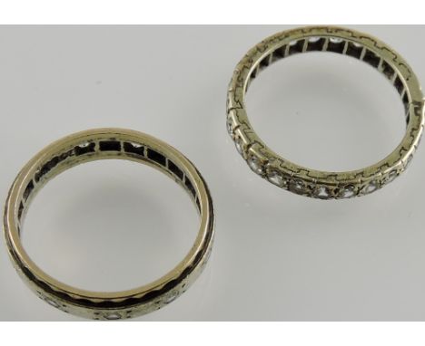 A diamond full eternity ring, together with another similar.