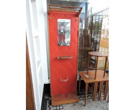 A 1950s red vinyl hallstand incorporating a mirror, shelf, umbrella stand and hooks, h:185cm