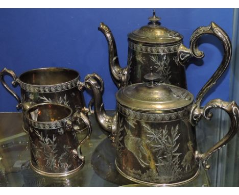 A late Victorian silver plated tea and coffee set, in the aesthetic style with beaded borders and scroll handles