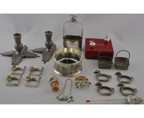 A quantity of silver plated items comprising a pair of thistle form candlesticks, a decorative 5 piece bar set, a cased set o