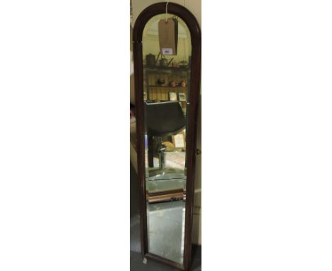 A narrow mahogany arch framed bevelled glass mirror, h: 120cm, together with two further carved wood mirrors