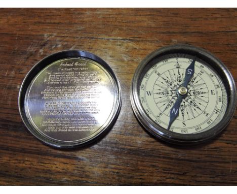 A brass cased compass with lid