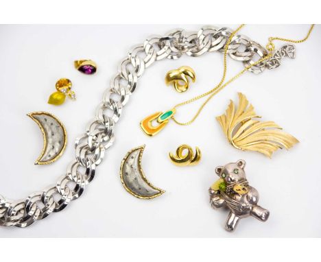 A selection of branded costume jewellery. Including a vintage silver tone double link necklace by 'MONET', a gold tone foliat