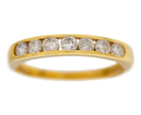 An 18k yellow gold seven-stone diamond band ring. Seven round brilliant-cut, white diamonds are 2mm approx., 0.50ct in total,