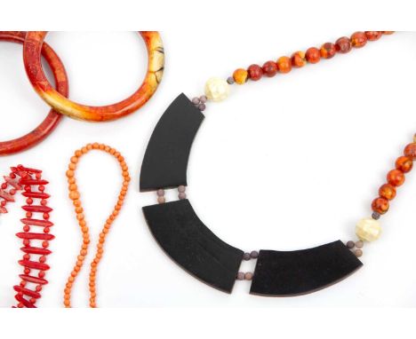 A collection of coral jewellery. To include a modern reconstituted sponge coral necklace, with matching bangle, another coral