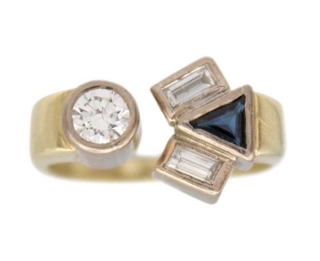 A diamond and sapphire abstract ring in 14k two-tone gold. The round brilliant-cut white diamond is 4mm in diameter approx., 