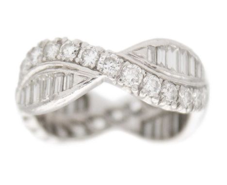 A diamond fancy crossover band ring in platinum. A band of brilliant-cut white diamonds, 2mm approx., overlapping with a band