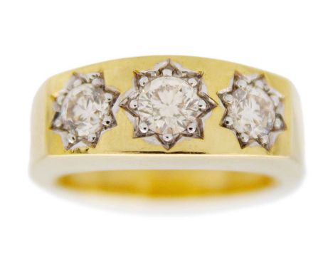 A 9k yellow gold gipsy-style three-stone diamond ring. Brilliant-cut, white diamonds, principal stone 0.41ct, side stones tot