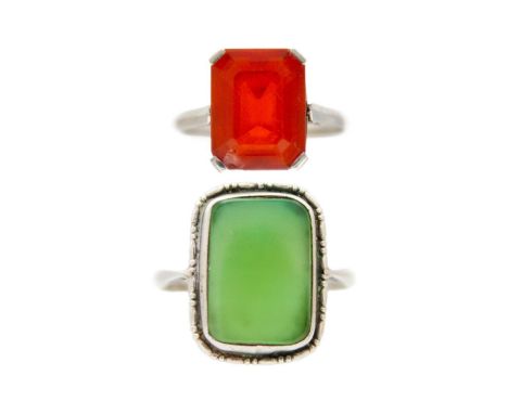 A Fire opal platinum solitaire ring, with jade cabochon silver solitaire ring. Emerald cut fire opal has a chipped corner, 11