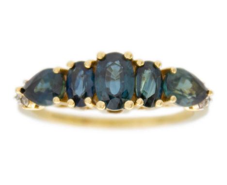 A 9k gold Australian teal sapphire and diamond ring. The sapphires of an oval and pear shape mixed-cut, the principal stone i
