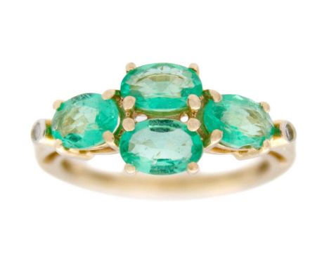 A 9k gold emerald and diamond ring. Four oval mixed-cut emeralds, 4mm x 6mm each, set with brilliant-cut bezel-set diamond on