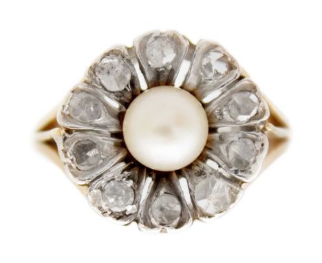 An antique pearl and diamond cluster gold ring. A flower-shape design with rose-cut diamonds on petals, the cultured pearl is