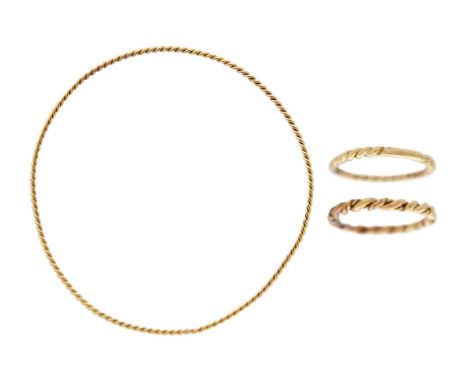 A 9k gold twisted design bangle with two twist stacking rings. The bangle is 6.5cm in diameter, fancy twist ring in size J1/2