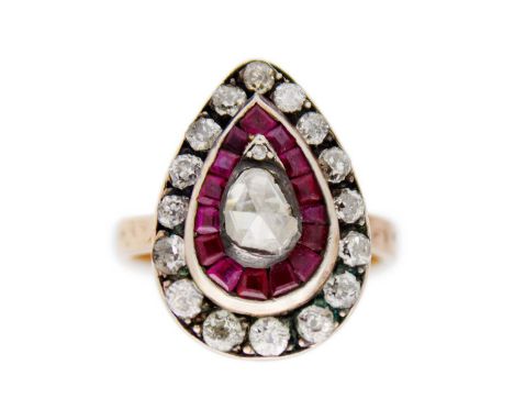 A vintage style 8K rose gold ruby and diamond ring. Silver top, pear-shaped head, 2cm x 1.4cm, with pear shaped rose-cut diam