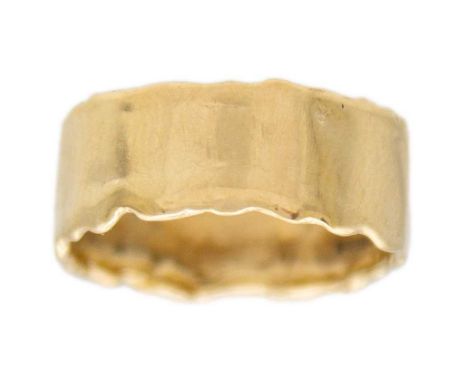 A 9k gold wide band ring. Of an irregular edging, hallmarked Birmingham, width 7mm approx., size I, weight 2.68g.