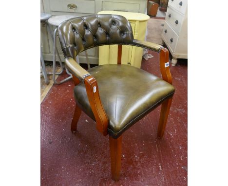 Green leather button back armchair